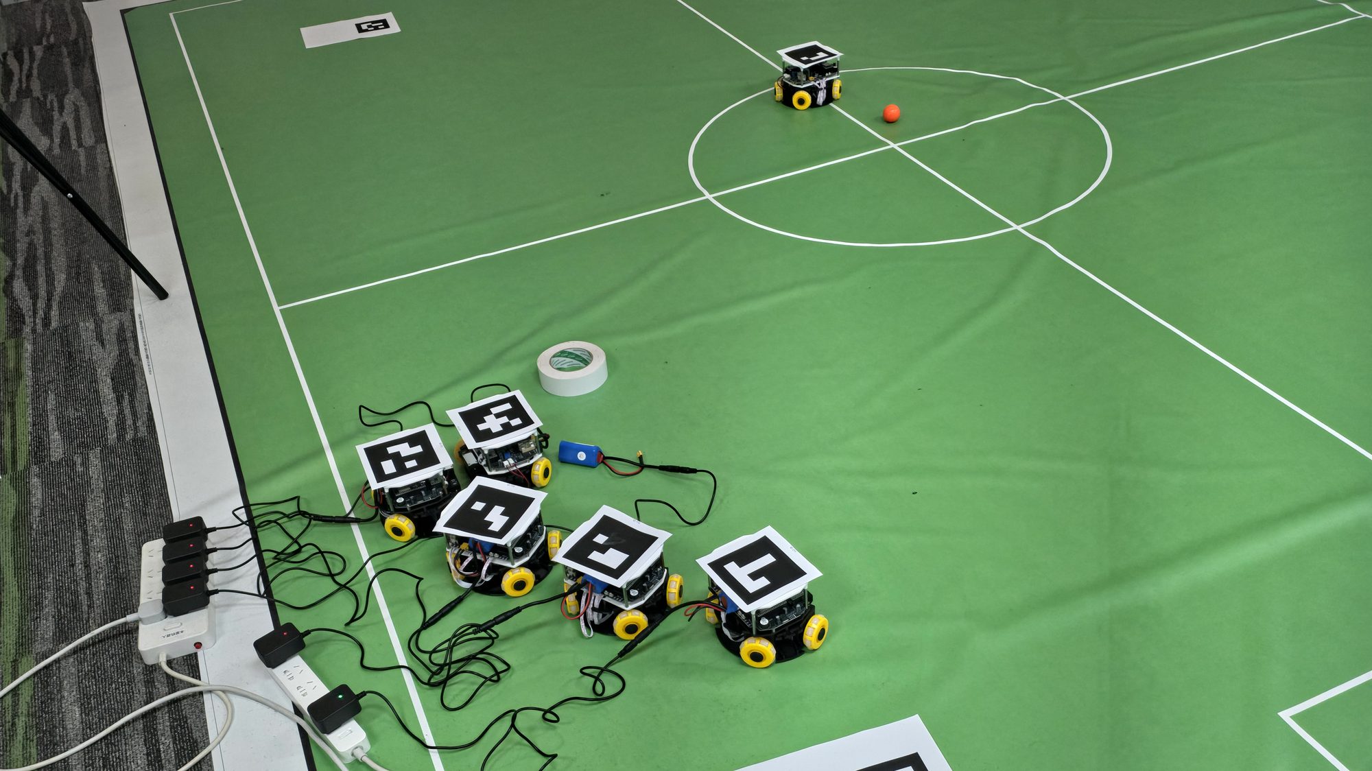 Small-size football robots on a green pitch